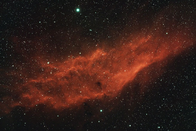 The California nebula, shaped somewhat like the state it is named after, appears quite orange in colour here